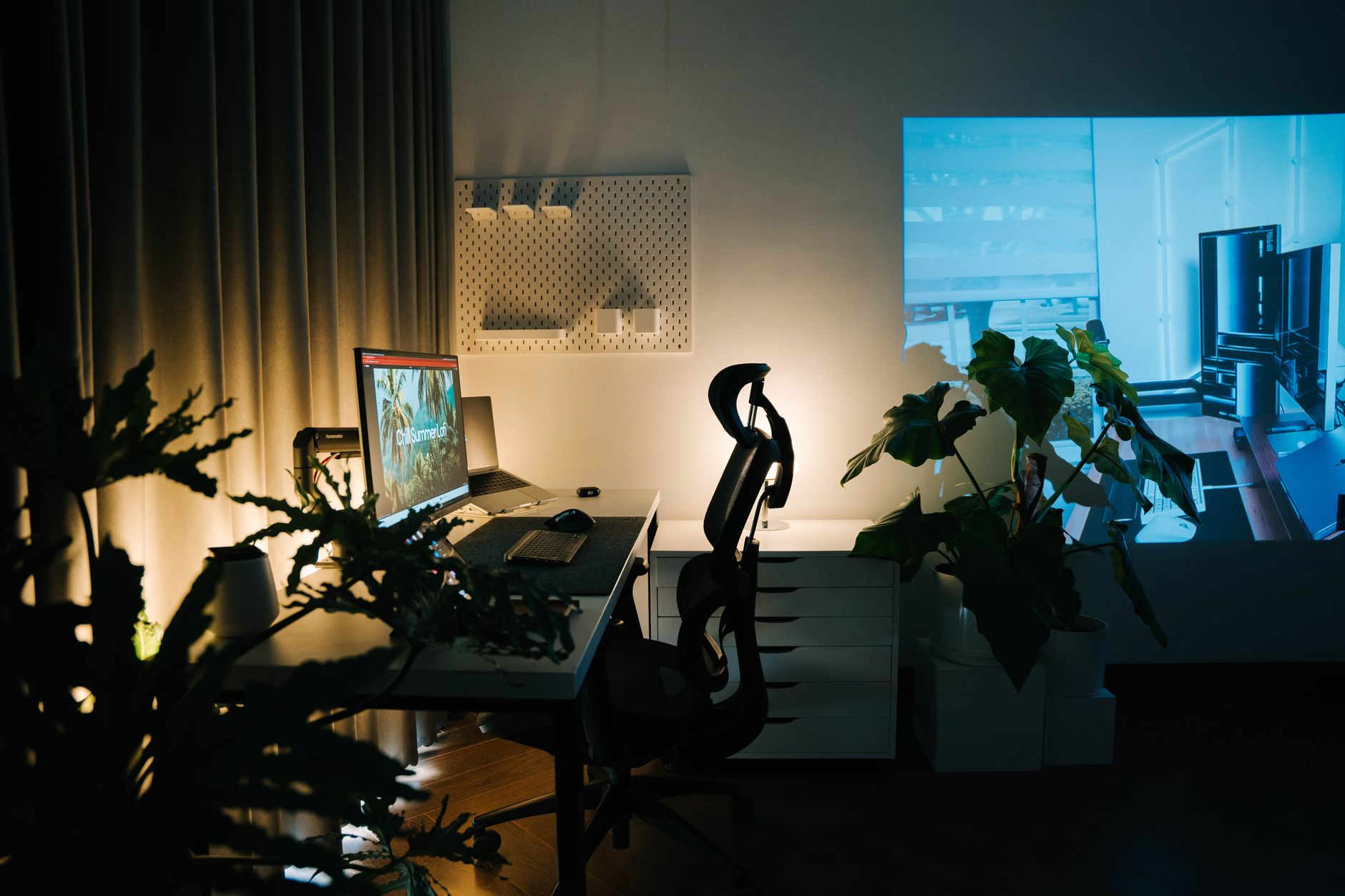 a sparse, minimalist open-plan tech office at dusk, rows of empty standing desks lit by ambient overhead lighting, no people visible