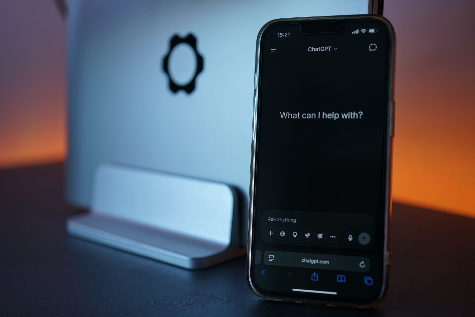 a smartphone screen displaying a chat interface with election-related text bubbles, resting on a wooden desk beside a folded newspaper