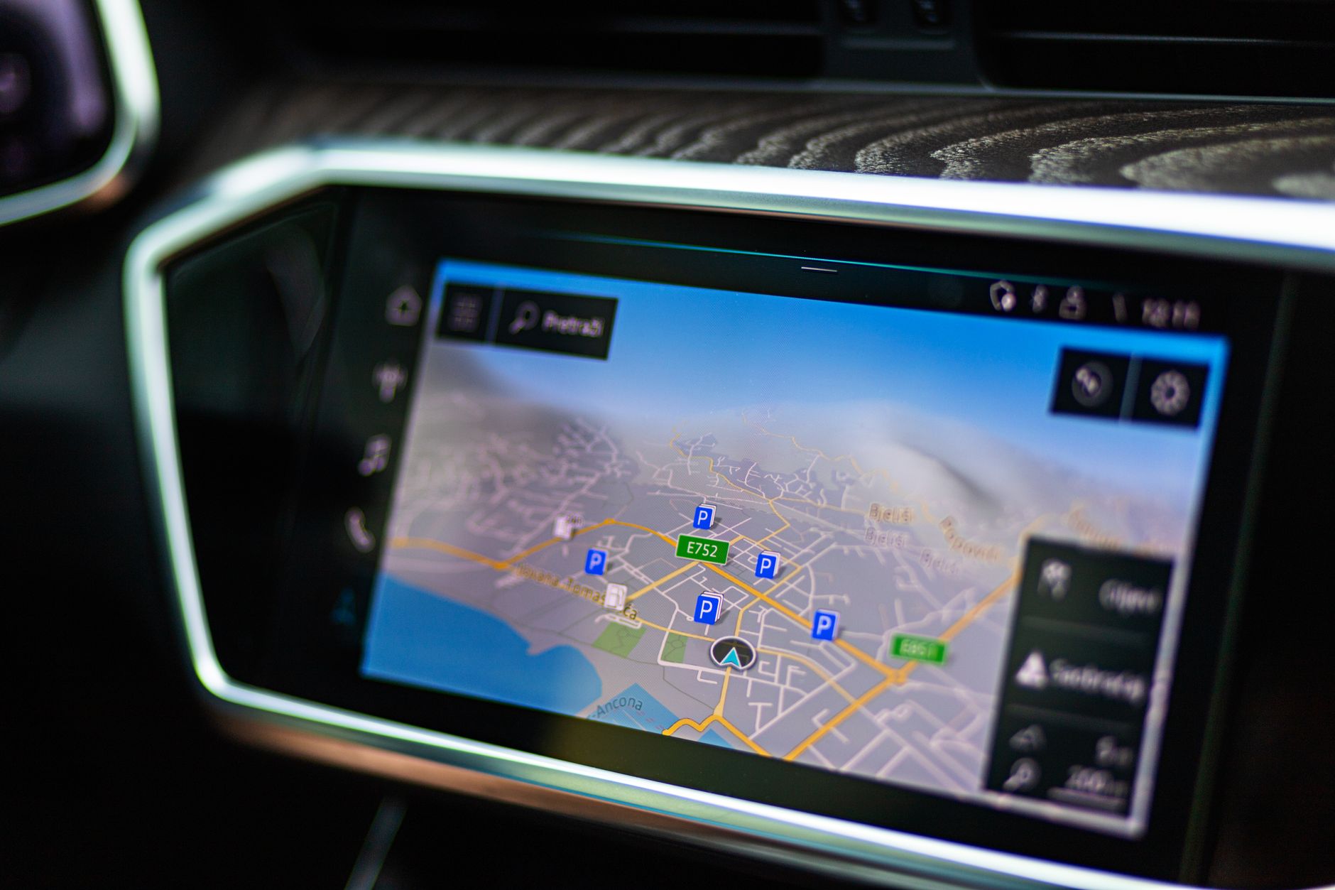 a tablet mounted in a tractor cab displaying crop monitoring dashboards with colorful field heat maps on screen