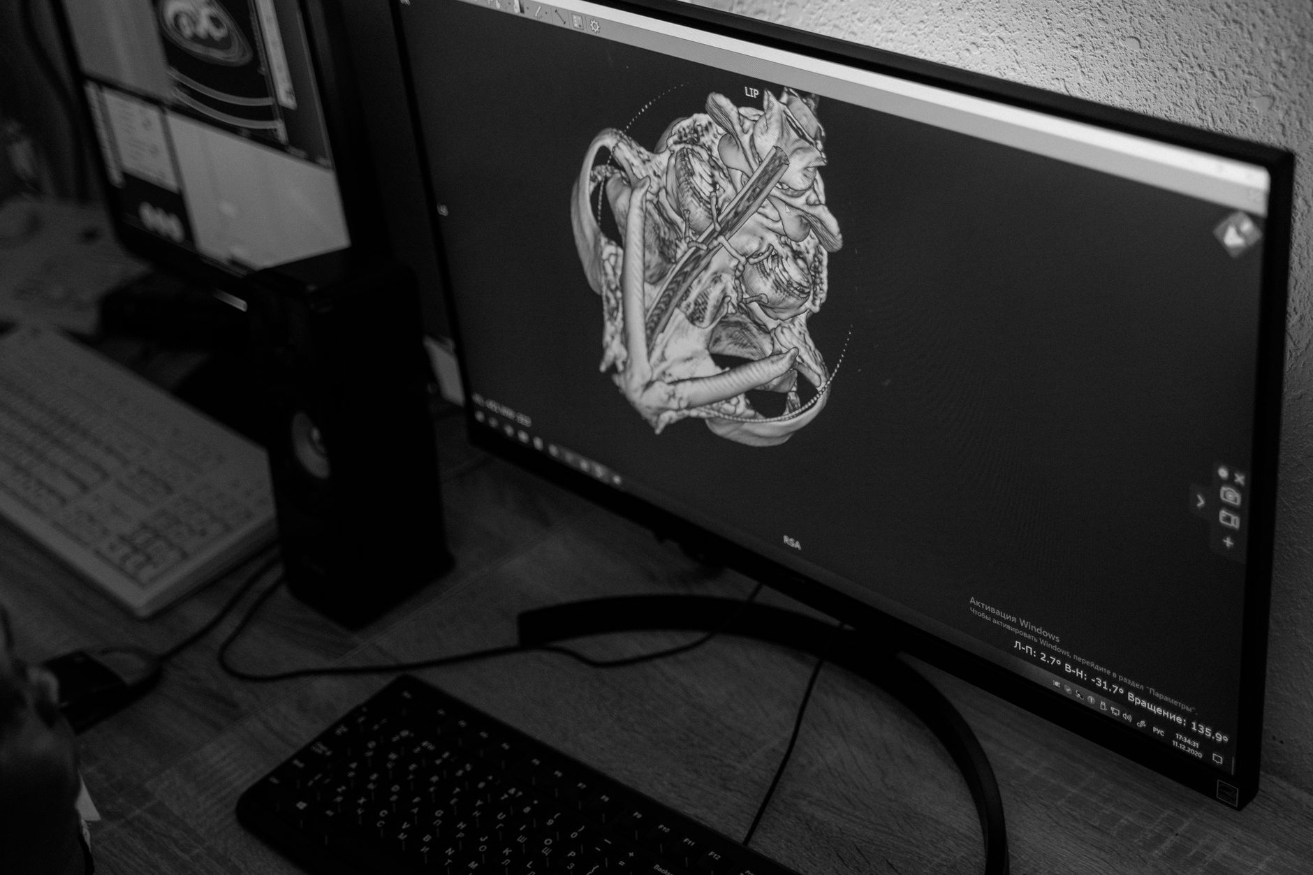 a developer workstation showing a real-time AI-generated 3D environment rendered on dual monitors in a dimly lit research lab