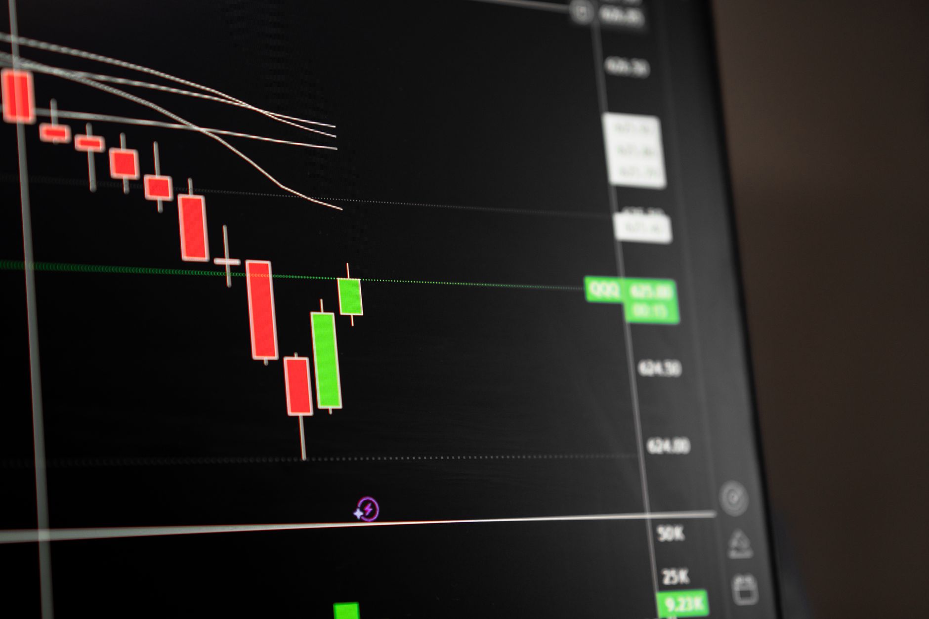 close-up of stock market trading terminal screens displaying pharmaceutical sector ticker data and red declining price charts
