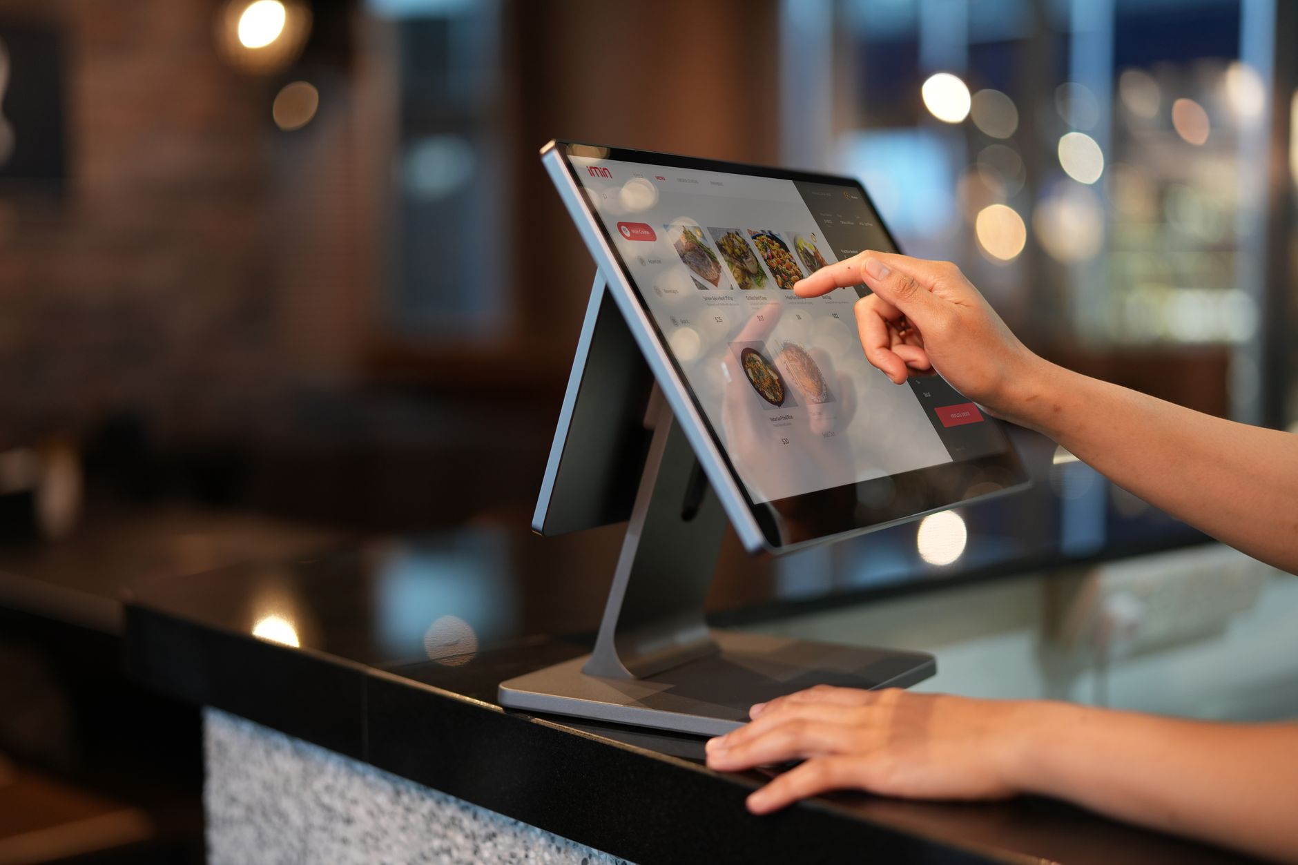 close-up of an industrial touchscreen procurement terminal displaying a structured product catalog interface with part numbers and specification filters
