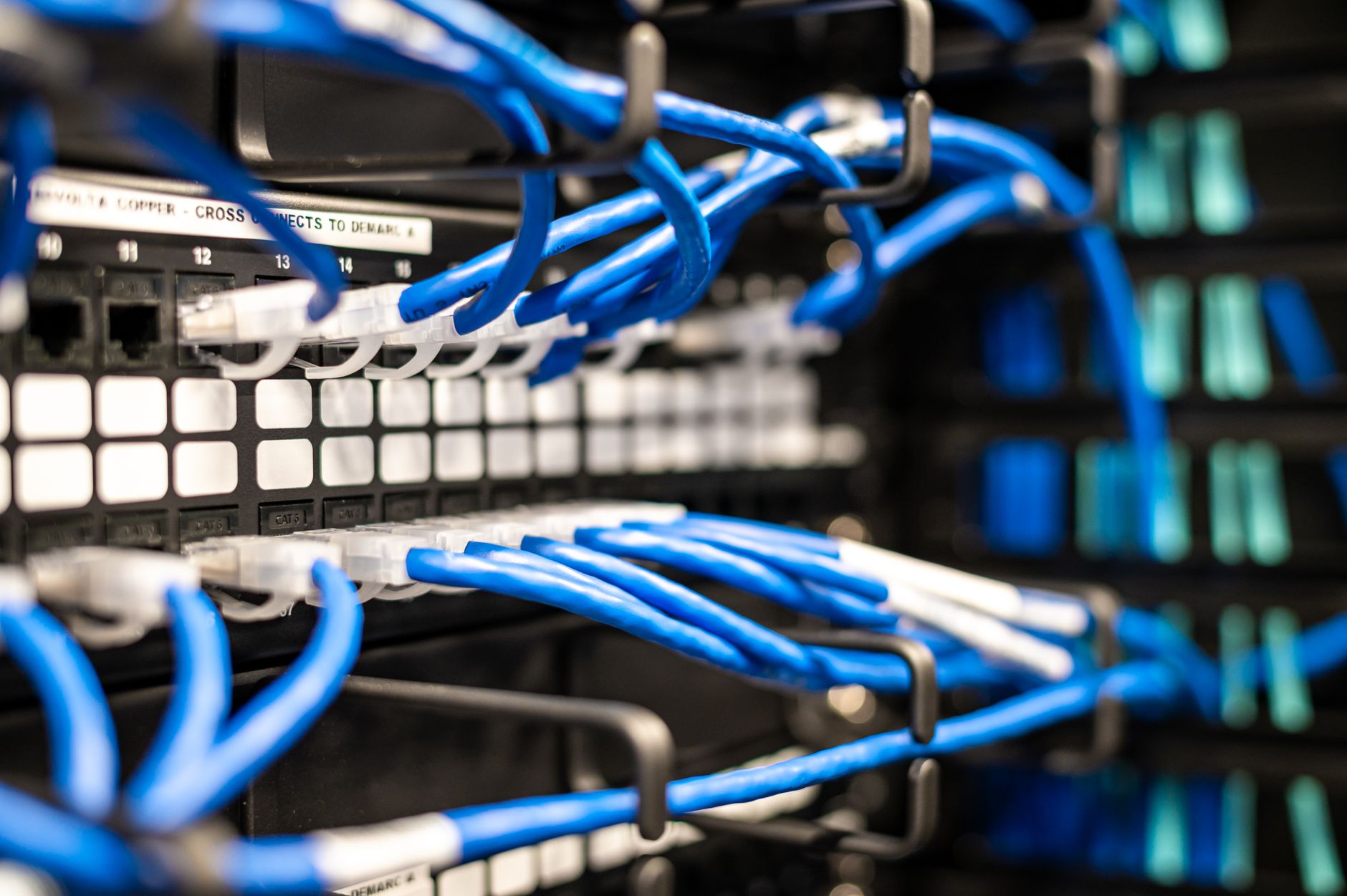 a close-up of a server rack management interface screen showing software version numbers and patch status indicators in a data center cabinet