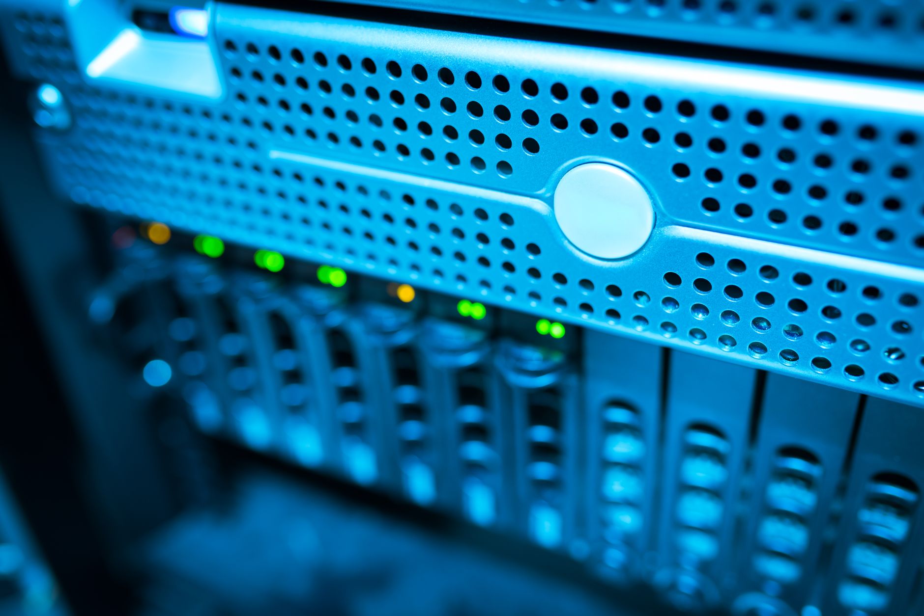 a cluster of rack-mounted servers inside a dimly lit colocation facility, indicator lights blinking in rows, cables bundled neatly overhead