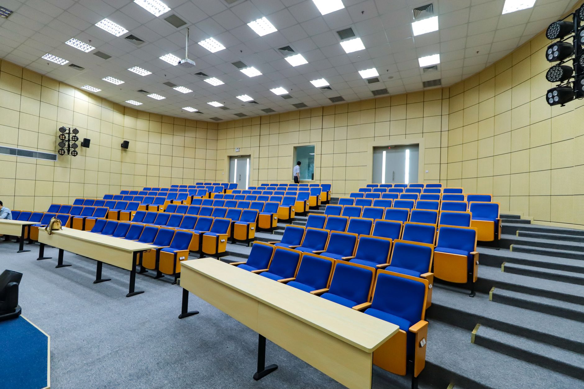 ornate formal conference room with gilded chairs and tall windows overlooking a city skyline, representing international diplomatic or philanthropic institutional settings