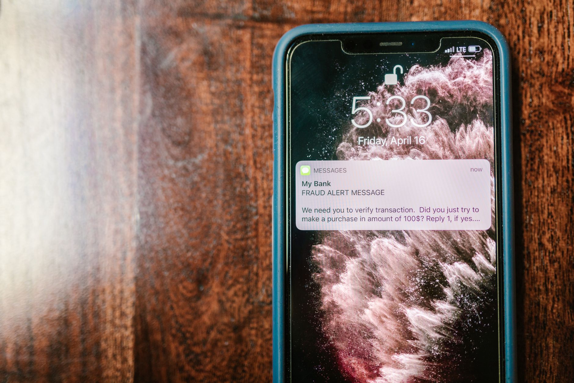 close-up of a smartphone screen showing a banking app interface with a personalized product recommendation notification appearing in real time