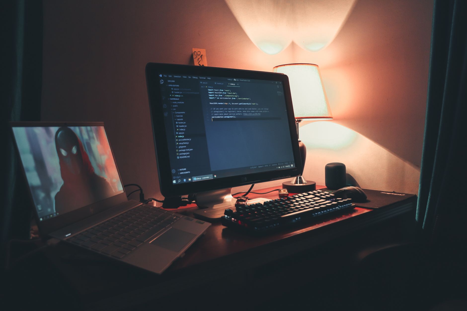 a laptop screen displaying an open-source code repository interface in a dimly lit home office with mechanical keyboard in foreground