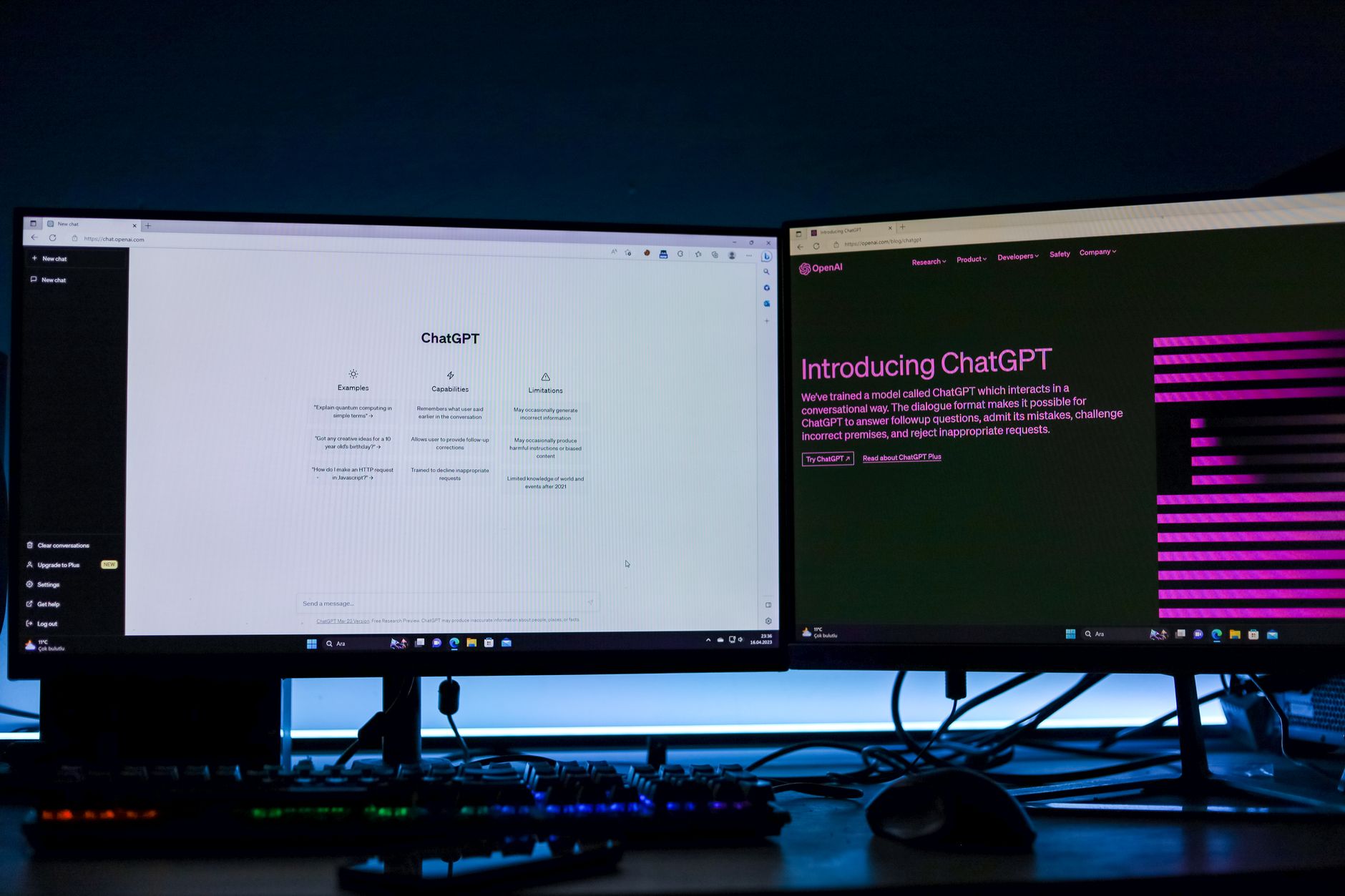 a laptop screen displaying a Telegram desktop interface with an active chat window, photographed on a cluttered office desk at night with dim ambient lighting