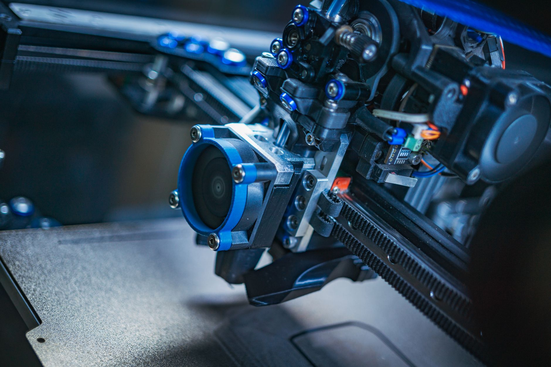 close-up of a lightweight AR headset prototype on a product testing bench, with circuit components and sensor modules visible along the frame