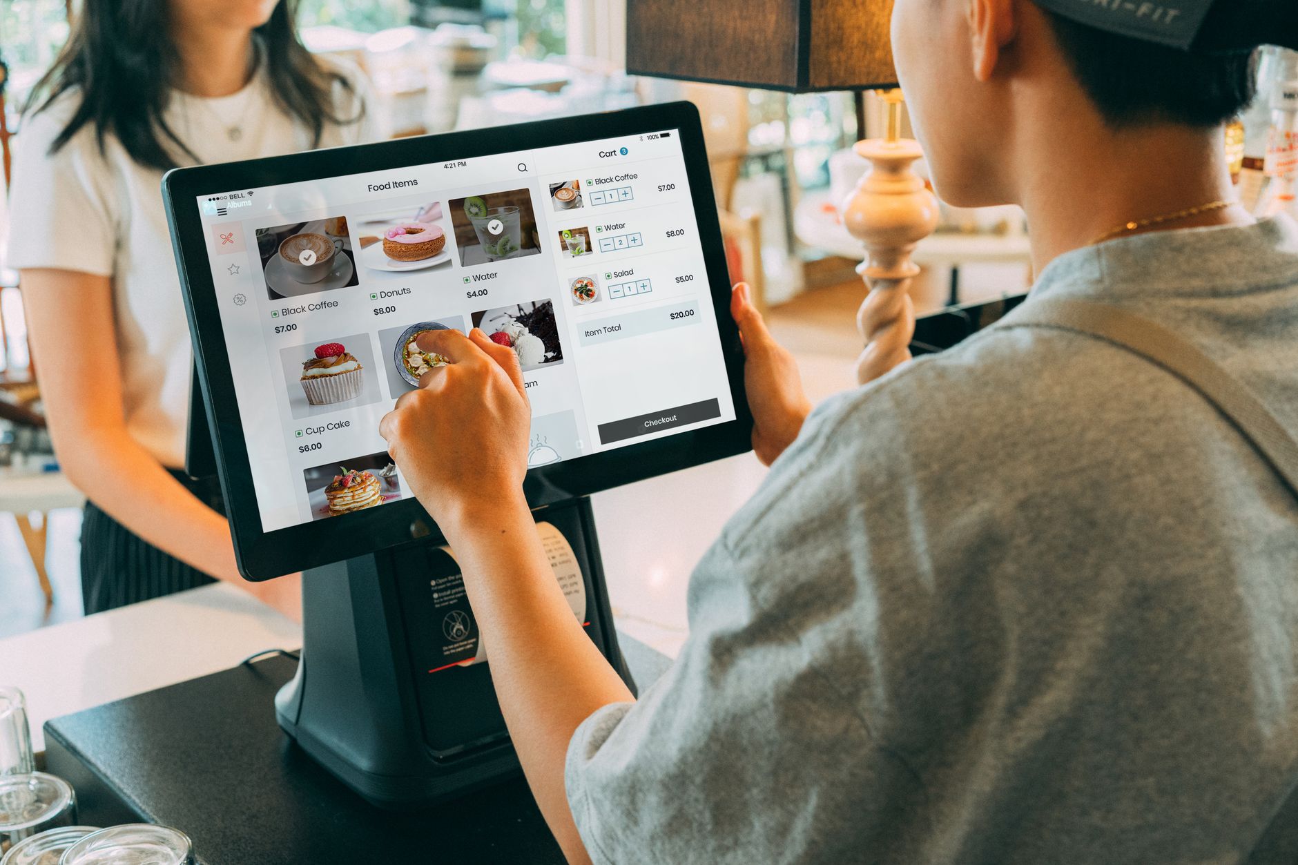 a close-up of a digital product authentication interface displayed on a tablet screen resting on a retail counter, with product packaging visible in the background