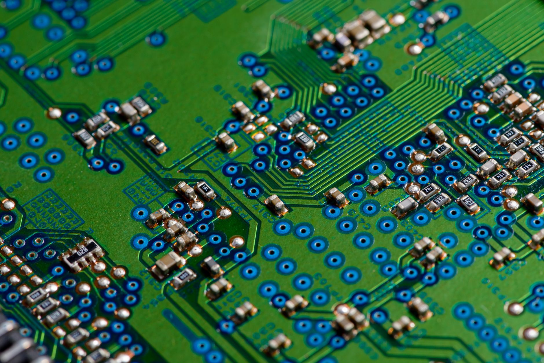a close-up of a custom AI accelerator chip mounted on a test board inside a semiconductor lab, surrounded by precision measurement equipment