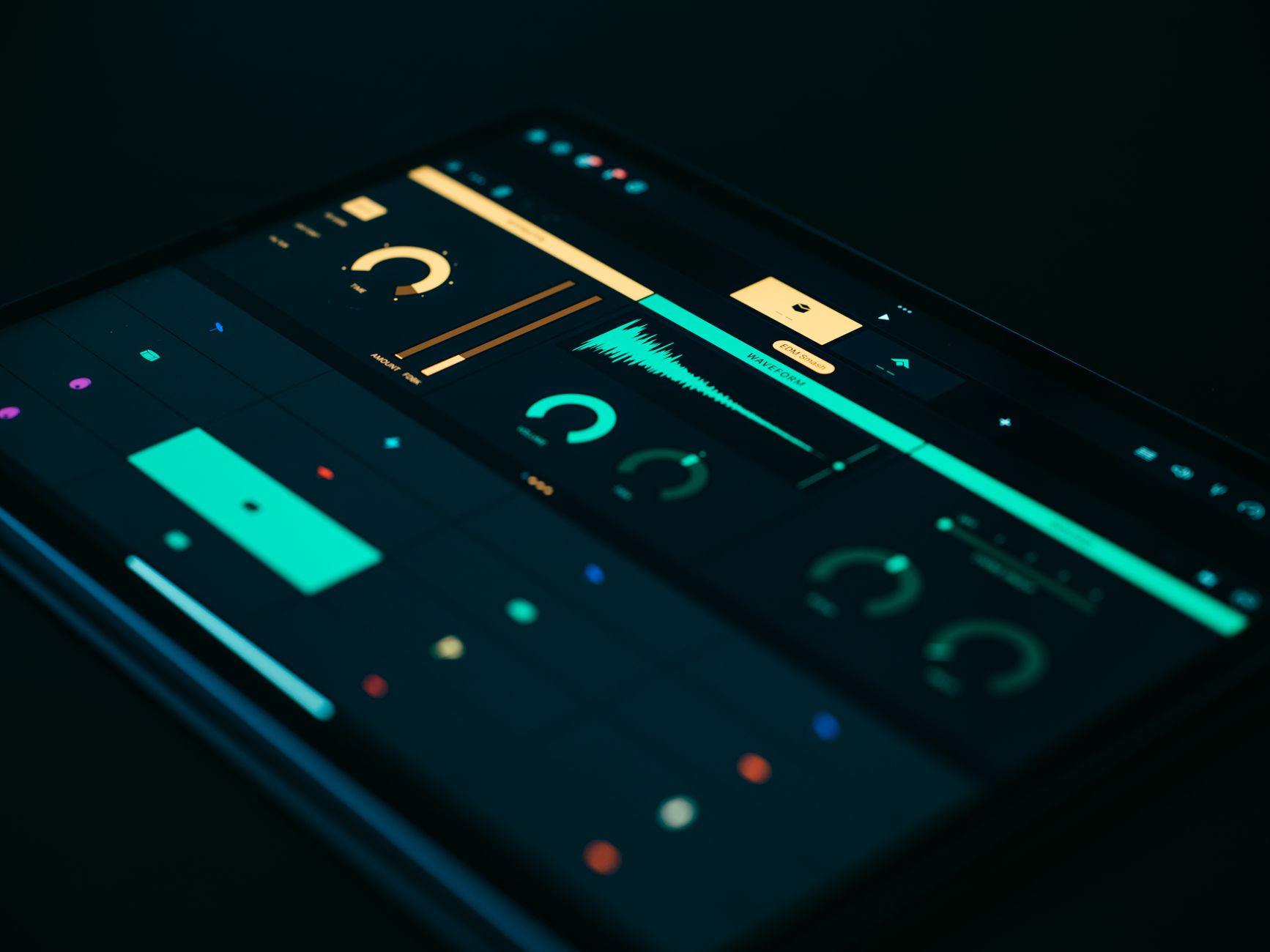 a close-up of a large touchscreen workstation displaying a multimodal AI interface with text, waveform audio, and image panels arranged side by side in a clean dark-mode UI