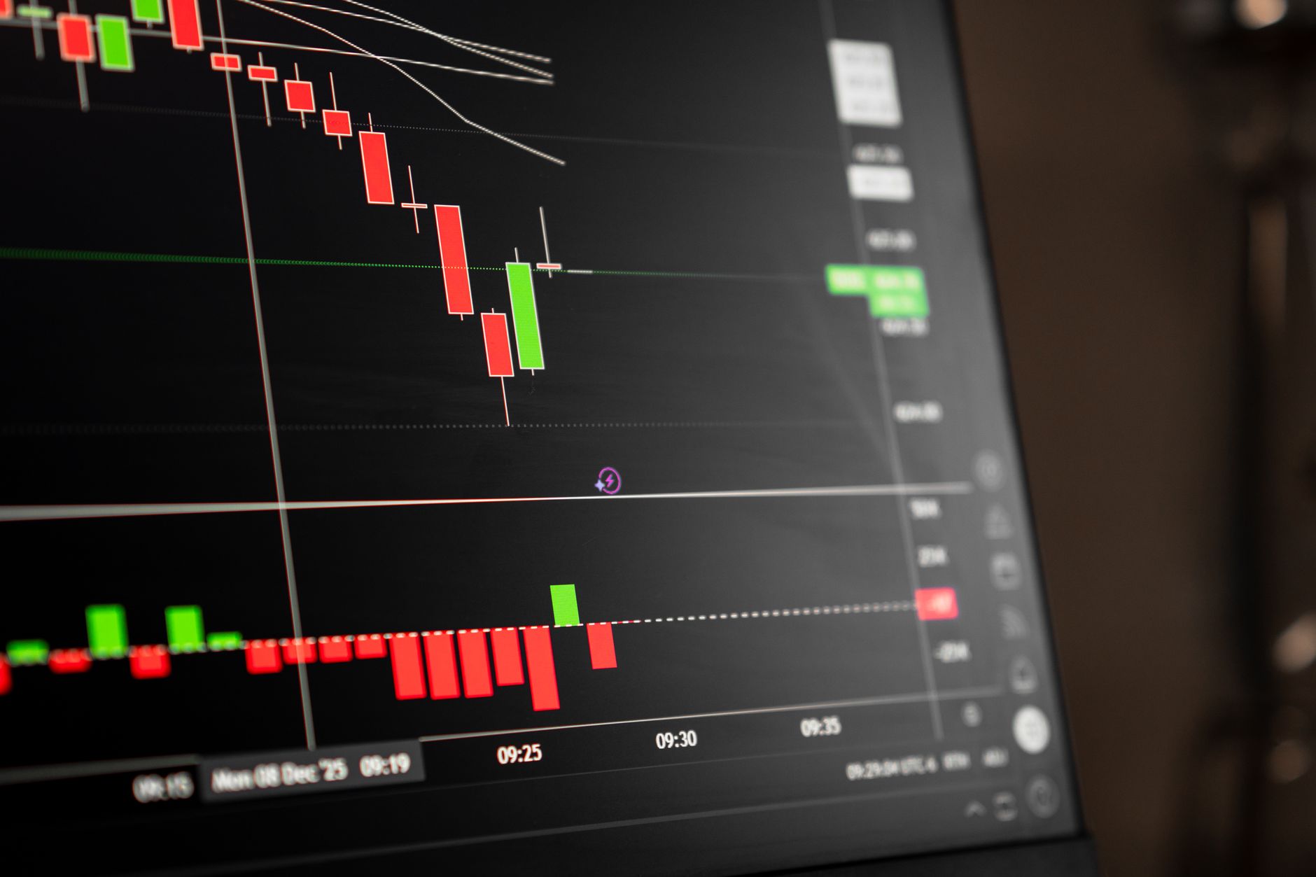 close-up of bond trading data on a stock exchange screen, with figures and ticker symbols in green and red